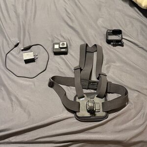 Gopro Hero 7 Black  Camera with Chest Mount, charger, and full 2 hrs SD card